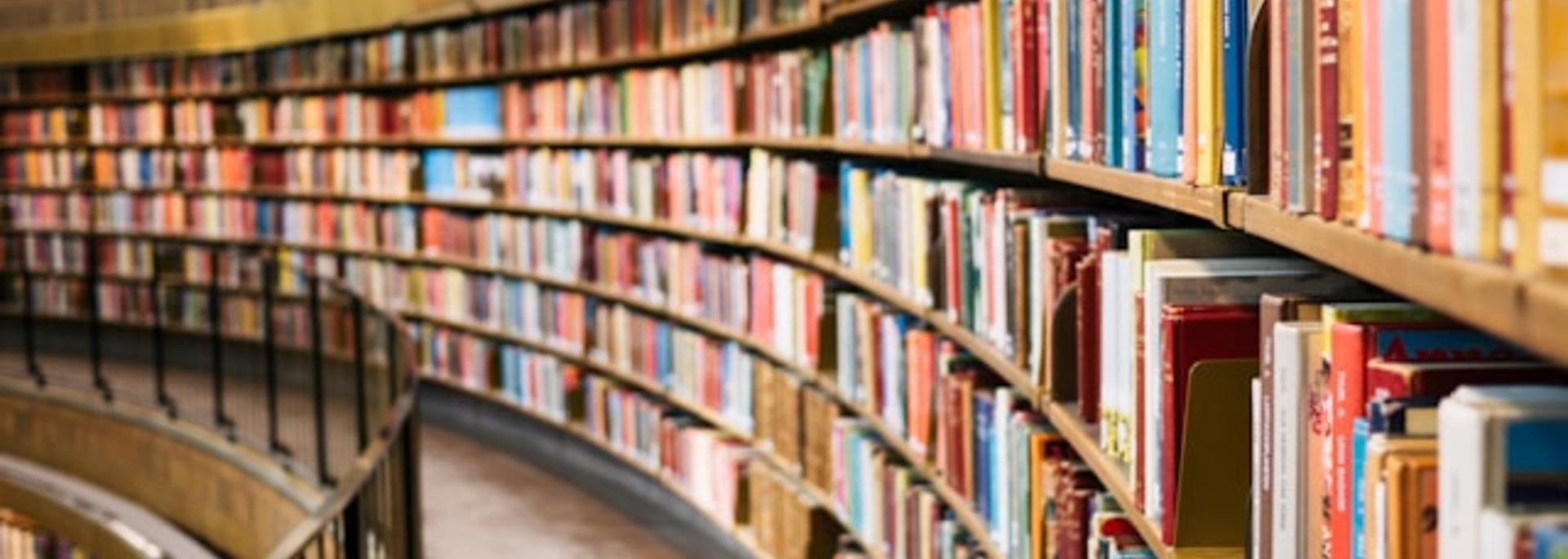 Curved view of libray stacks full of books 
